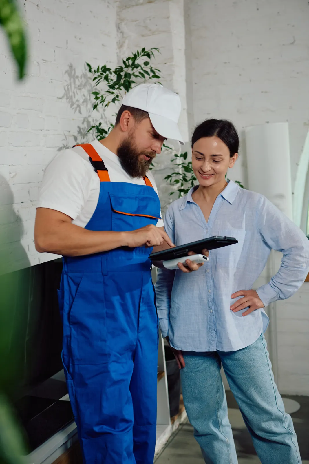 Field service technician using a tablet on a home service job