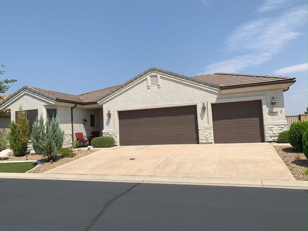 A finished AllPro Painters home exterior with fresh stucco and trim